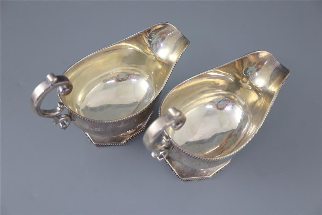A pair of late Victorian silver pedestal sauceboats, by Roskell, Roskell & Hunt, 22oz.